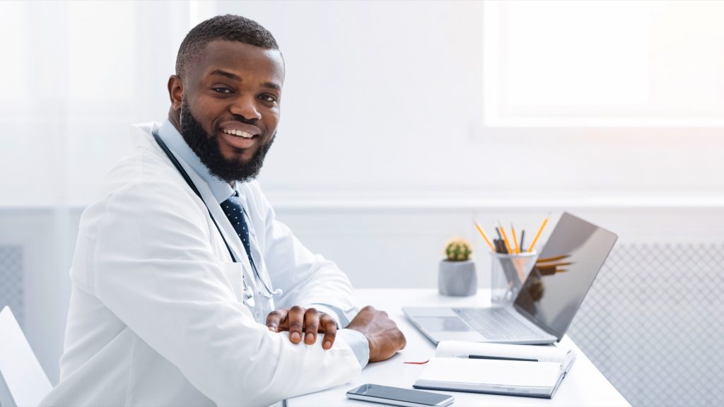 diabetes doctor working with laptop at clinic