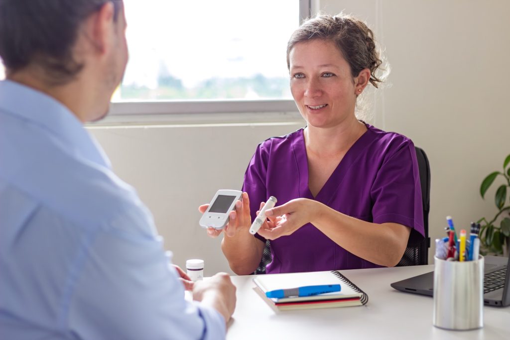 Doctor explaining glucose test