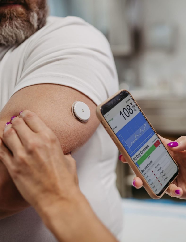 man with cgm patch